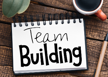 Carnet avec "team building" noté dessus